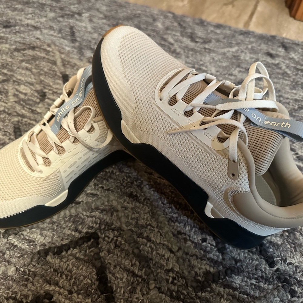 While On Earth Beige and Black Sneakers